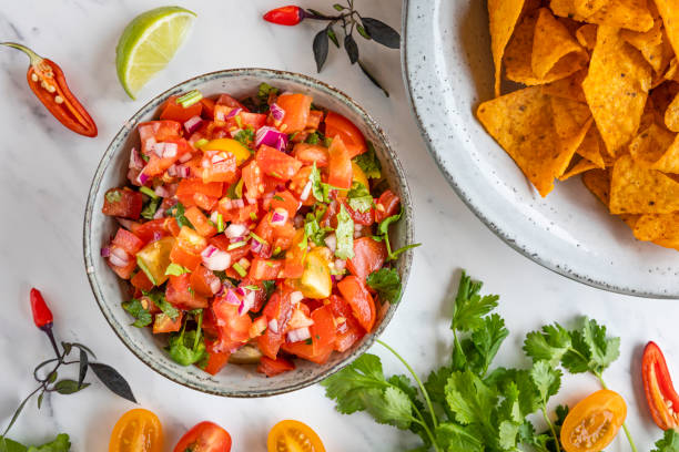 istock Tex Mex Pico de Gallo tomato sauce with nacho tortilla chips 1262196451
