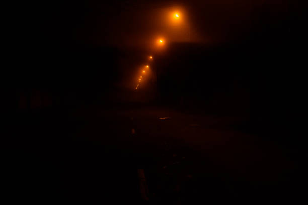 istock Old street at night illuminated by the lanterns 1262196656