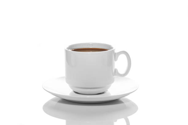istock small white porcelain Cup with hot coffee on a white saucer side view isolated on a white background 1262197757