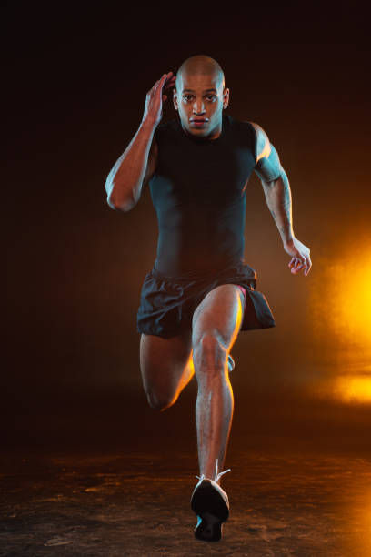 istock Running young man looking concentrated and determined 1262198869