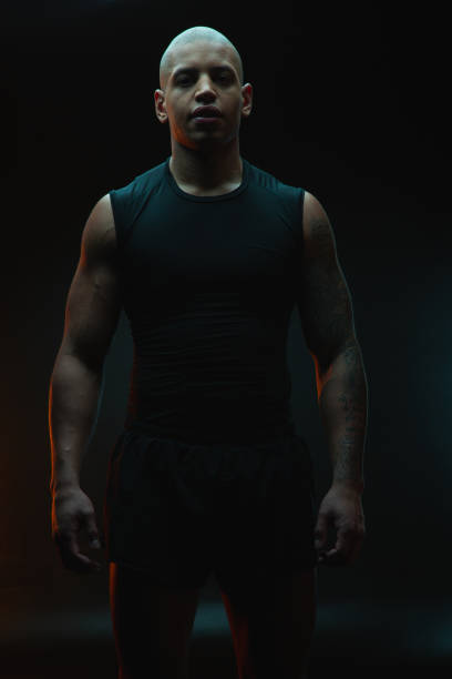 istock Confident handsome man against the dark background 1262199081