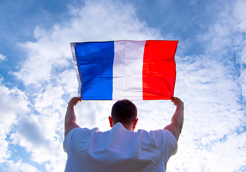 Man holding Flag of France, concept picture