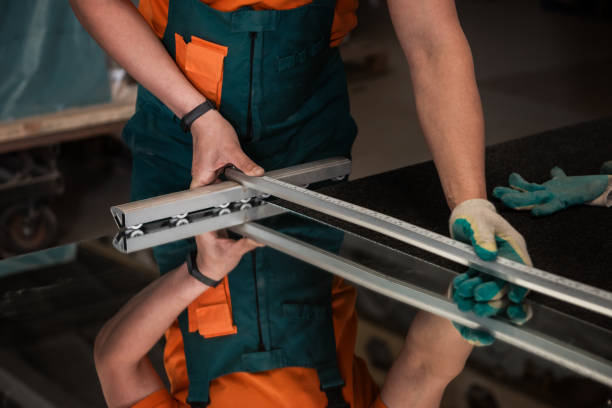 istock Worker cutting the surface of glass mirror 1262201280