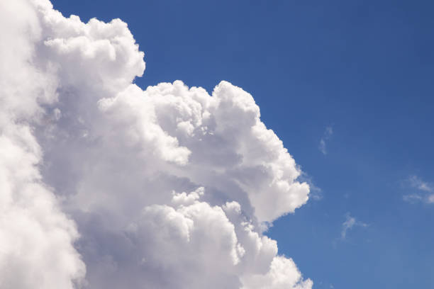 istock White fluffy and blue sky with clouds (Cumulus clouds). 1262217919