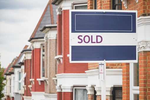 Sold sign displayed outside a terraced house in Harringay Ladder area, London, England