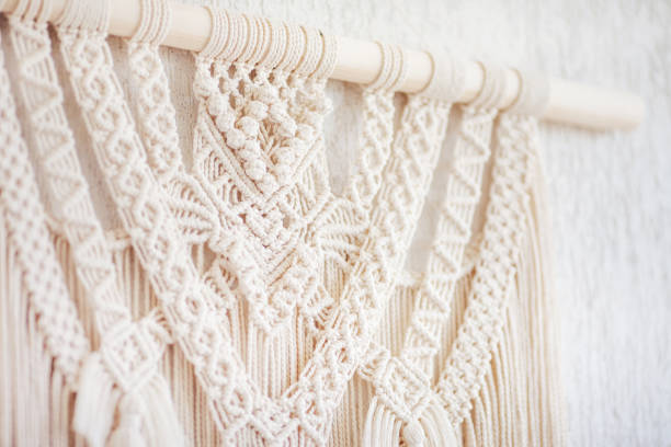 istock Close-up of hand made macrame texture pattern.  ECO friendly modern knitting DIY natural decoration concept  in the interior. Flat lay. Handmade macrame 100% cotton. Details close up. Female hobby. 1262231504