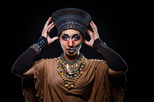 Close-up portrait of a model girl with makeup. girl with a big black turban on her head. concept is beauty and fashion.