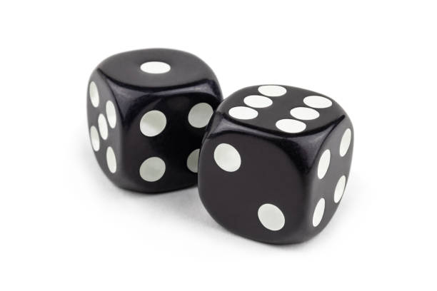 istock Two black dice isolated on a white background. One and six are so close. 1262247910