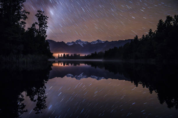 istock Reflection of star trails in Lake Matheson 1262248148