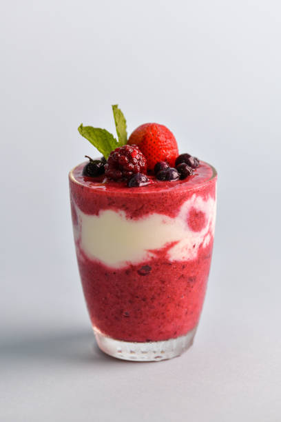 istock Mixed berry smoothie mixed with yogurt By blending thoroughly in clear glass With berries on top 1262248165
