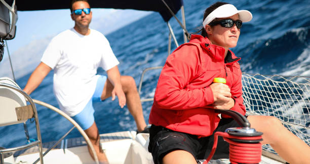 istock Attractive strong woman sailing with her boat 1262250719