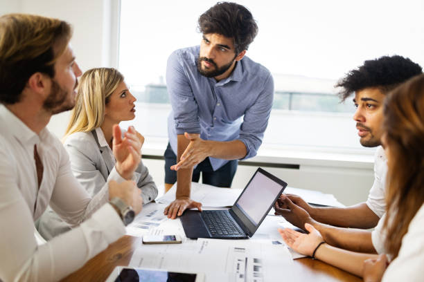 istock Business team people discussing documents and ideas at meeting 1262256784