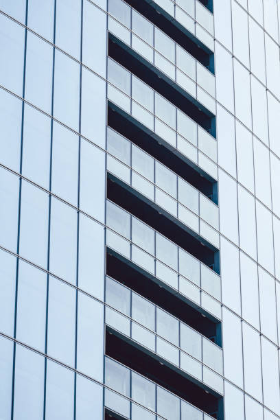 istock Facade of a glass building with open walkways 1262256834