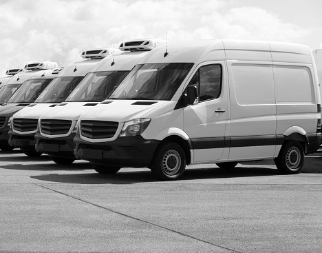 A Row of white vans, black and white image, more white vans in my portfolio