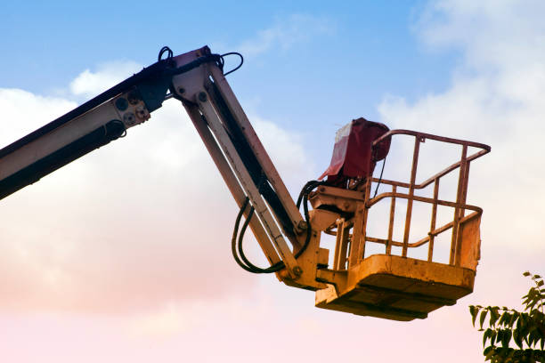 istock Tall yellow cherry picker, sunset sky background. 1262258916