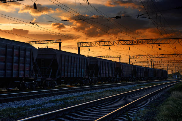 istock railway and cars in a beautiful sunset, dramatic sky and sunlight 1262275269