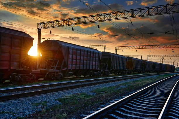 istock railway and rail cars in a beautiful sunset, dramatic sky and sunlight 1262275321
