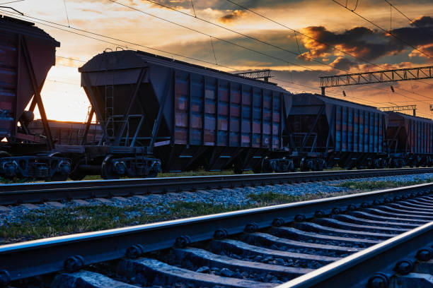 istock railway and rail cars in a beautiful sunset, dramatic sky and sunlight 1262275334