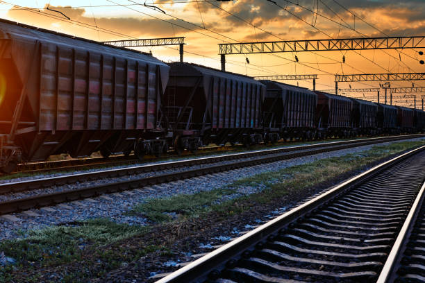 istock railway and rail cars in a beautiful sunset, dramatic sky and sunlight 1262275471