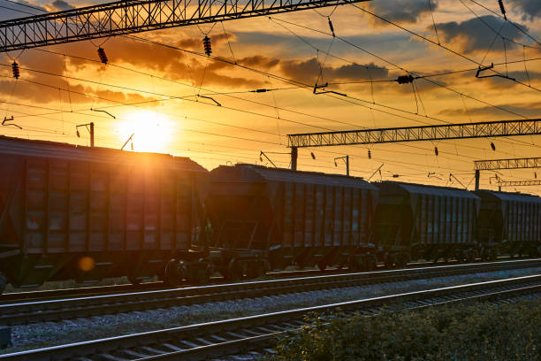 istock railway and cars in a beautiful sunset, dramatic sky and sunlight 1262275527