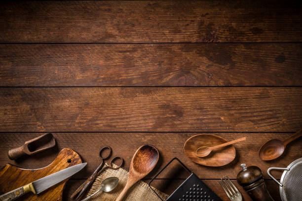 istock Various kinds of rustic kitchen utensils with copy space on a wooden plank 1262278671