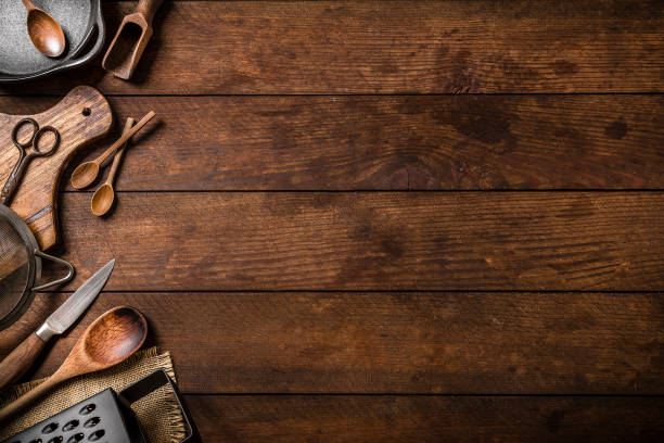 istock Various kinds of rustic kitchen utensils with copy space on a wooden plank 1262278688