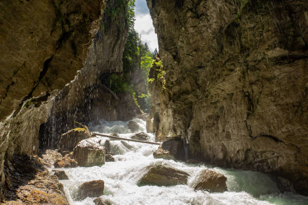 istock strong water flow with cascades in alps canyon 1262278940