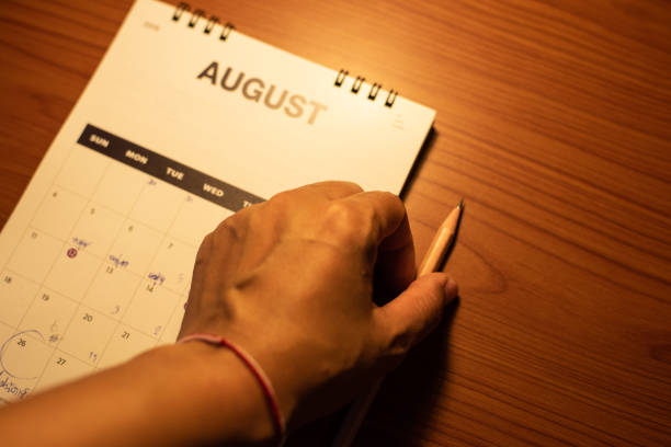 istock Blurred calendar on wood table in planning concept. 1262279047