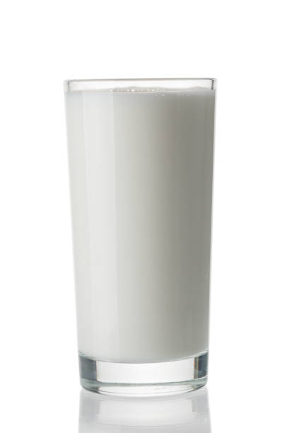 istock Milk glass closeup isolated on white background 1262279434