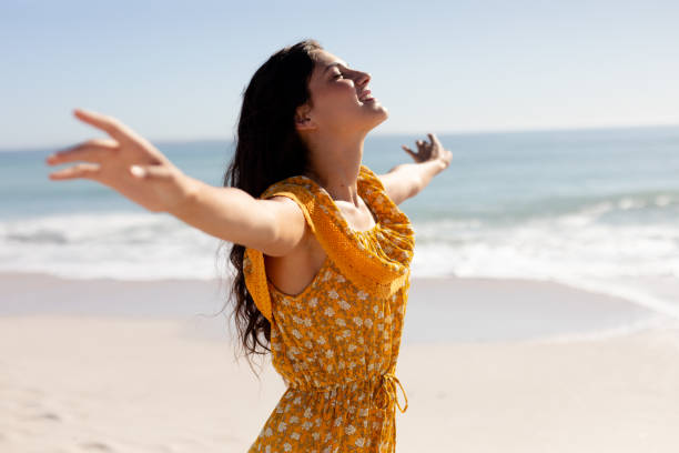 istock Caucasian woman standing on the beach 1262282276