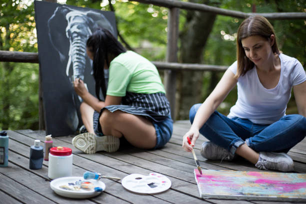 istock Two women painting in nature 1262283002