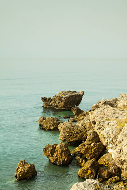 istock coast in the mediterranean sea with stones and waves 1262284266