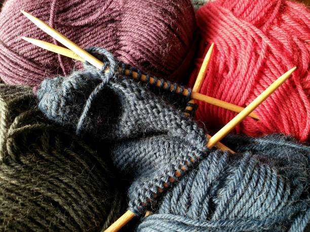 istock Knit club concept - Wool yarn with wooden needles 1262285656