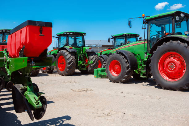 istock Tractor, combine at a field in sunlight. Confident, bright colors 1262286494