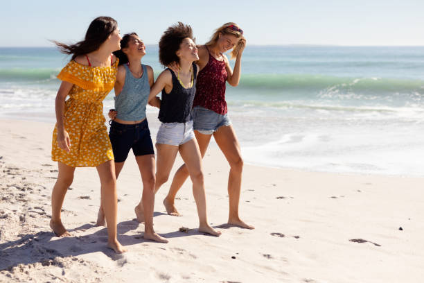 istock Multi-ethnic group of female standing on the beach 1262288286