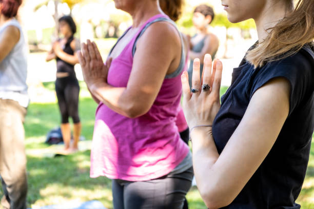 istock Several people attend an outdoor yoga session 1262288526