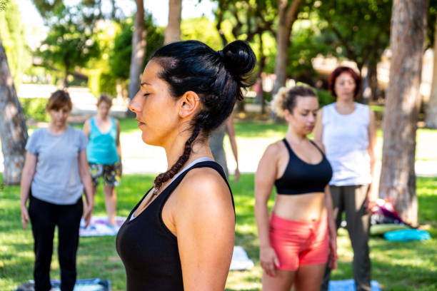 istock Several people attend an outdoor yoga session 1262288533
