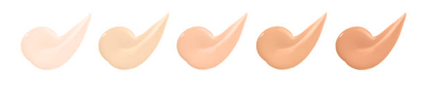 istock Beige nude liquid foundation set, concealer smear smudge drop. Collection different tones bb cream swatch sample isolated on white. 1262289845