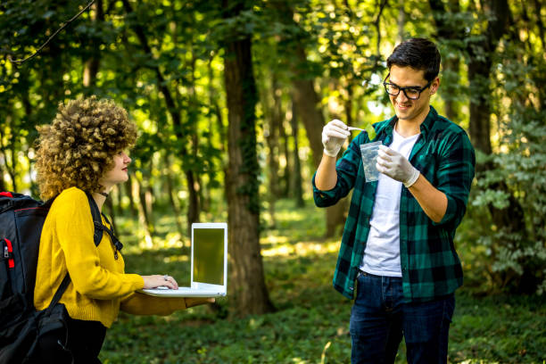 istock Scientist ecologist in the forest take samples of plants. 1262289898