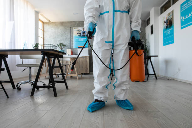 istock Man in protective suit preparing to disinfecting bank office 1262291586