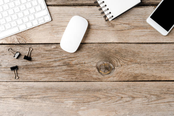 istock Office desktop with accessories on wooden background. Top view 1262292653