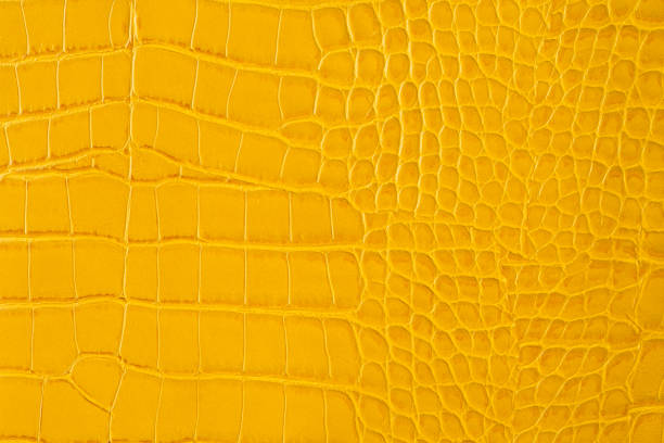 istock Yellow snakeskin leather background. Elegant texture 1262292878
