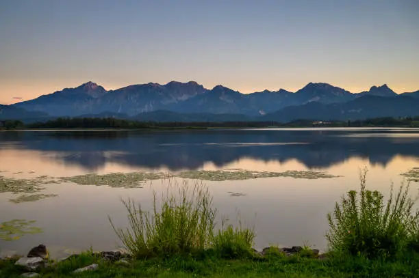 View of the Hopfensee with the Tannheim mountains in the background, Allgäu, Swabia, Bavaria, Germany