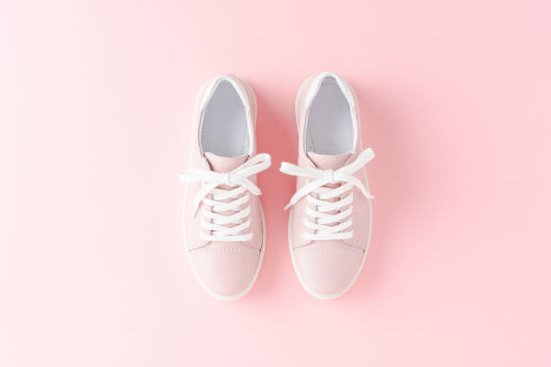 istock Pink women’s sneakers on background. Close up 1262294452