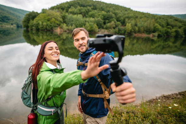 istock Filming hiking adventures for video vlog 1262294656