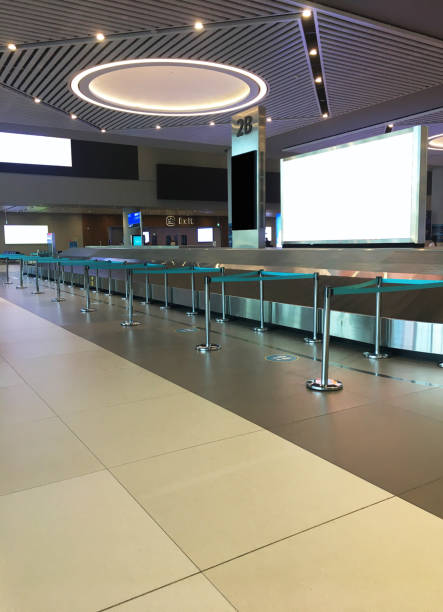 istock Airport baggage claim area and social distancing 1262294975