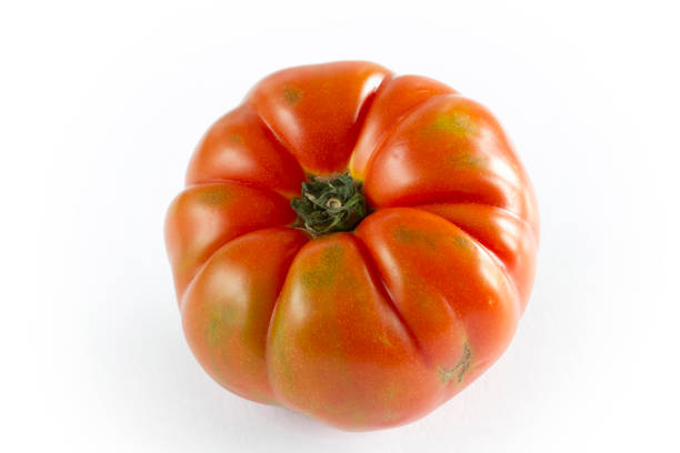 istock organic and red tomato background 1262295608
