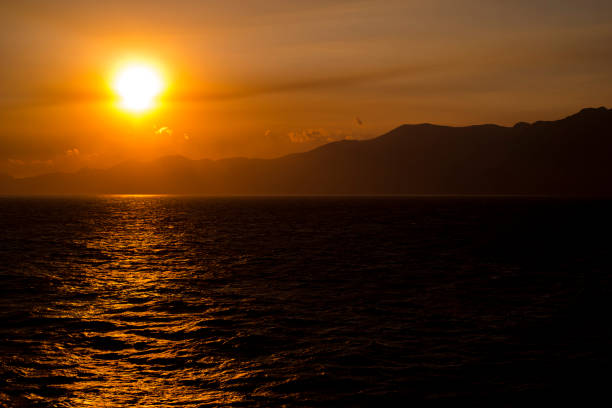 Sun sets down over the Greek island of Amorgos. Amorgos is the eastern most Cyclades island and one of the largest as well. It has an intense presence of excavation findings from the prehistoric and archaic time. In recent history the island has gained on interest by the travellers after being featured in Luc Besson’s film The Big Blue (1988).