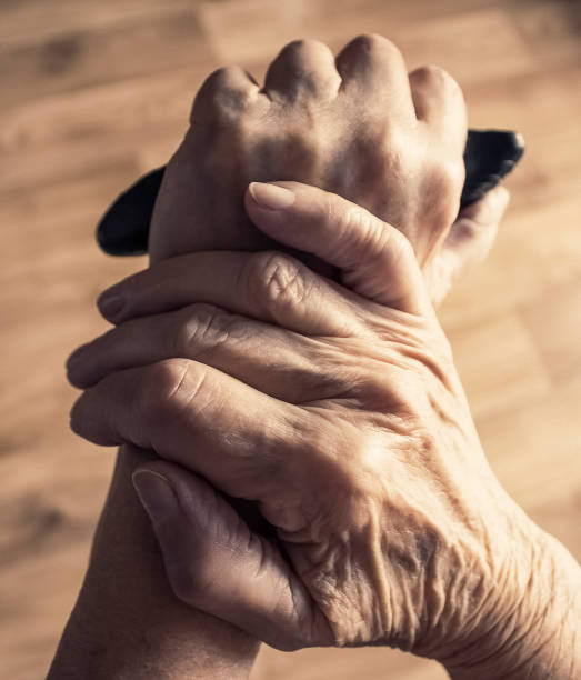 istock Lonely old woman leaning on walking stick and thinking about life 1262296159