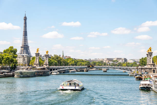 istock Boats on the River Seine by The Eiffel Tower in Paris 1262296420